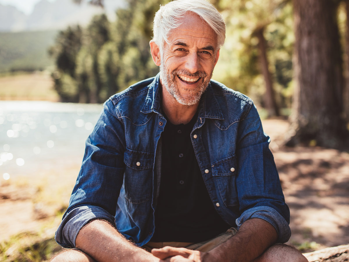 a man smiling outside